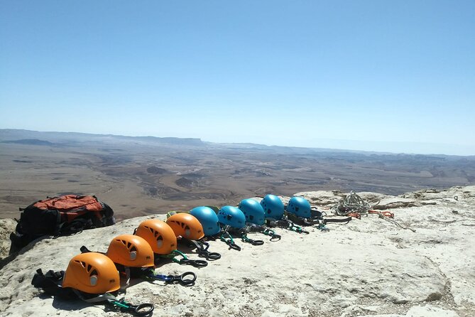 Rappelling Down the Ramon Crater Cliff - Stepping over the Ramon Crater rim