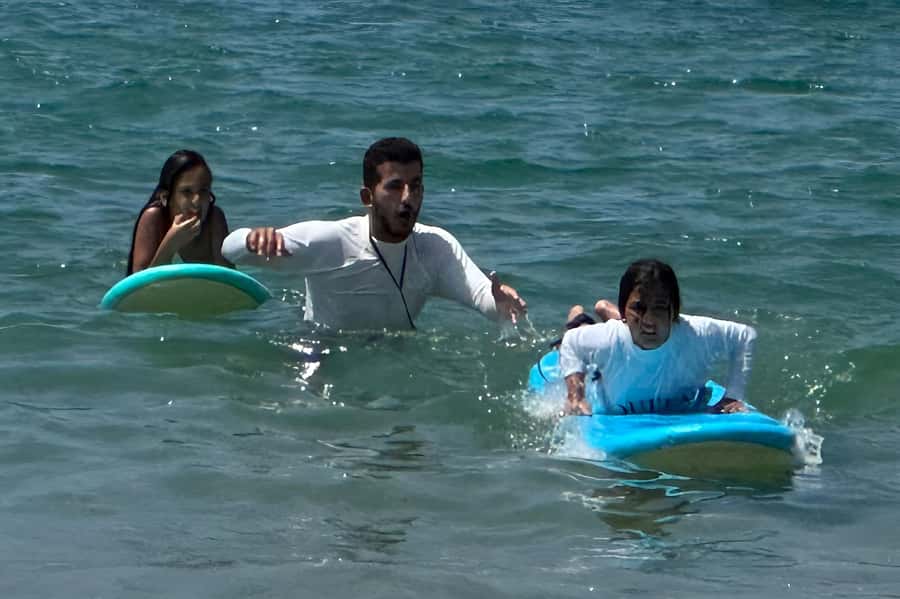 Tel Aviv: Professional Surfing Lessons at Beach Club TLV - Soft-top boards and wetsuits for the water session